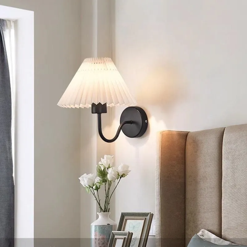 Retro LED wall lamp in iron finish with apricot colour option for bedside reading
