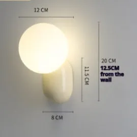 Nordic bedside wall lamp in black with acrylic shade and resin body
