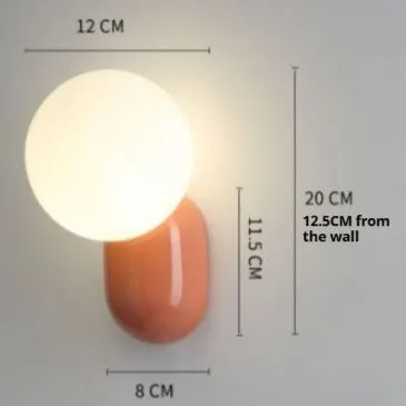 Nordic bedside wall lamp in black with acrylic shade and resin body