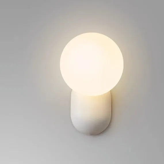 Nordic bedside wall lamp in black with acrylic shade and resin body
