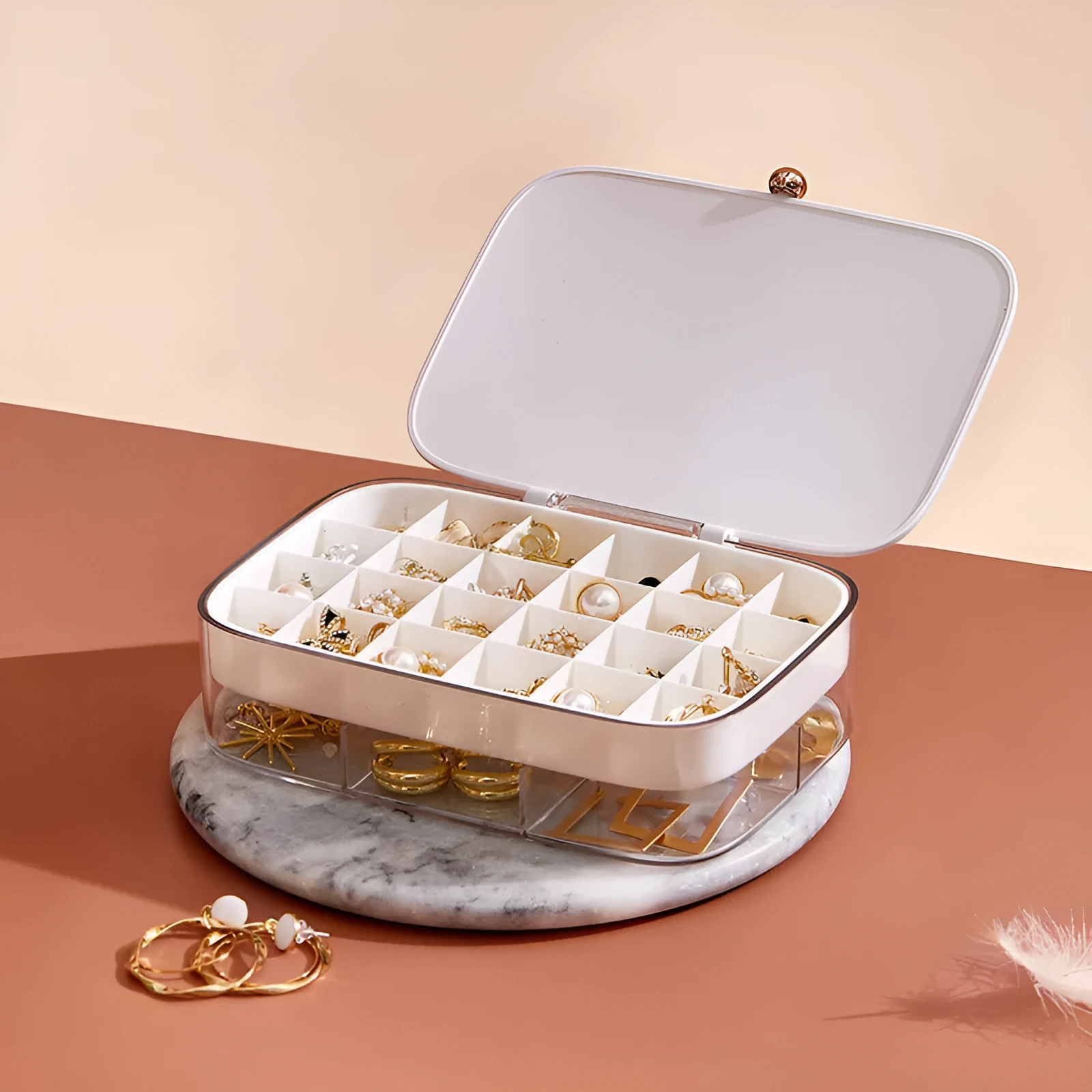 Green minimalist multi-layer jewellery storage box with lid open, showing internal compartments.