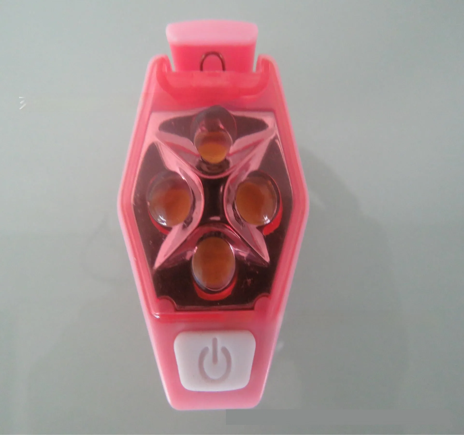 Multi-colour LED diamond night running clip lamp with seven colour options shown on black background