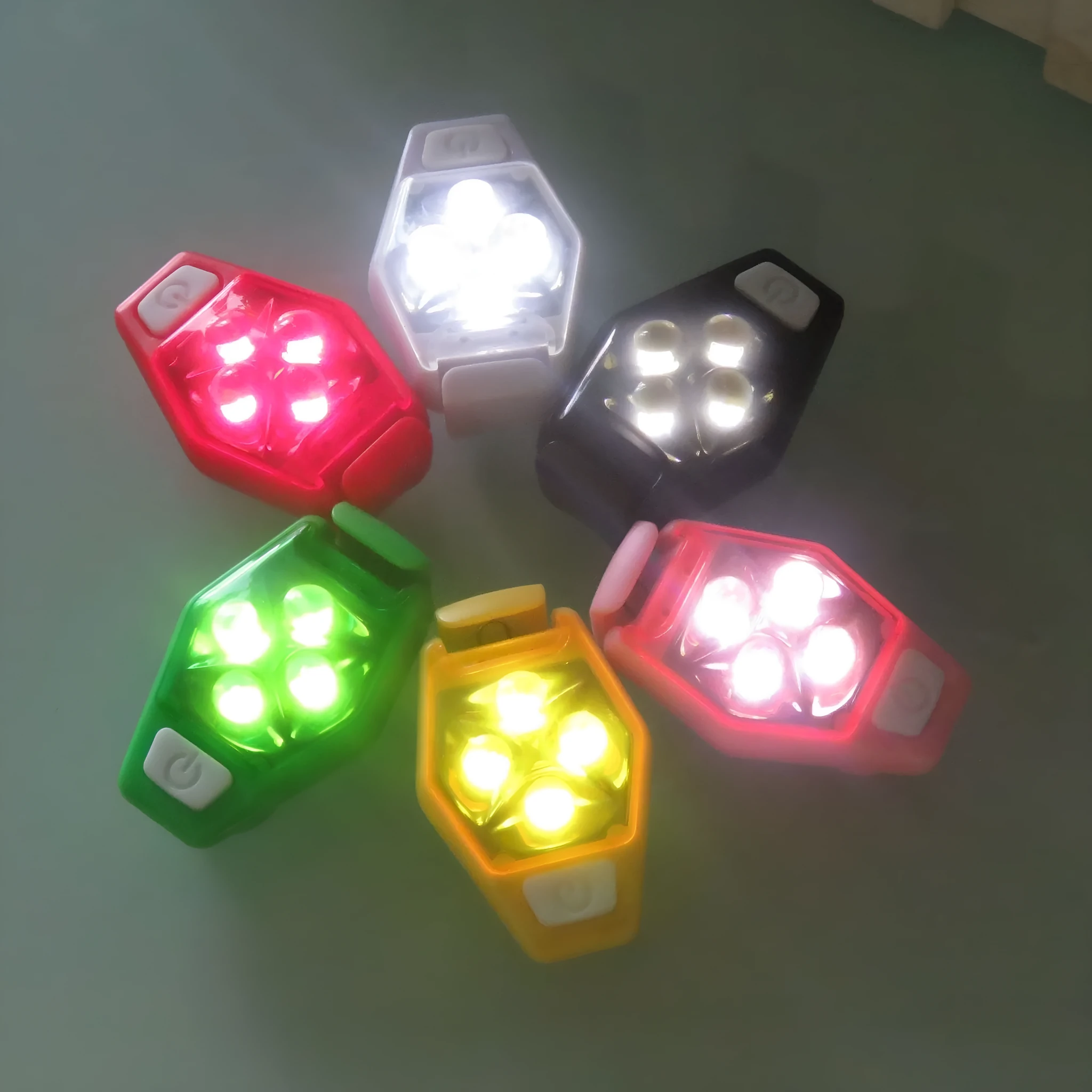 Multi-colour LED diamond night running clip lamp with seven colour options shown on black background