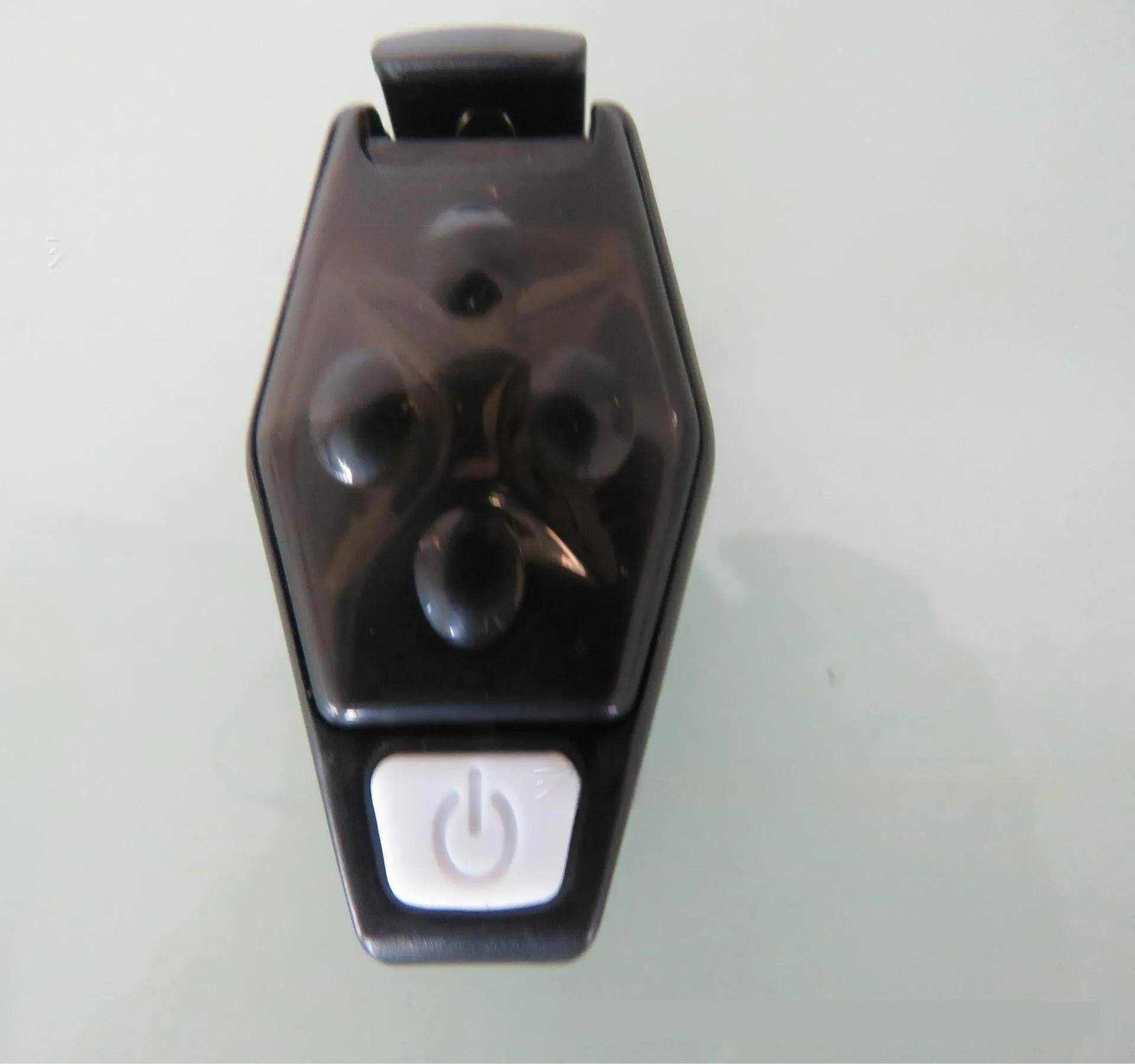 Multi-colour LED diamond night running clip lamp with seven colour options shown on black background