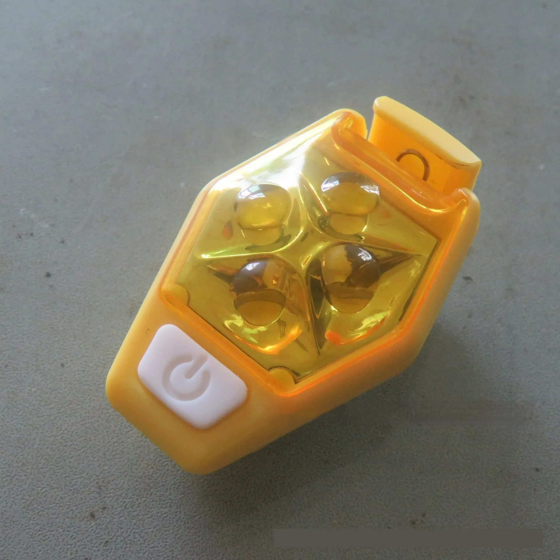 Multi-colour LED diamond night running clip lamp with seven colour options shown on black background