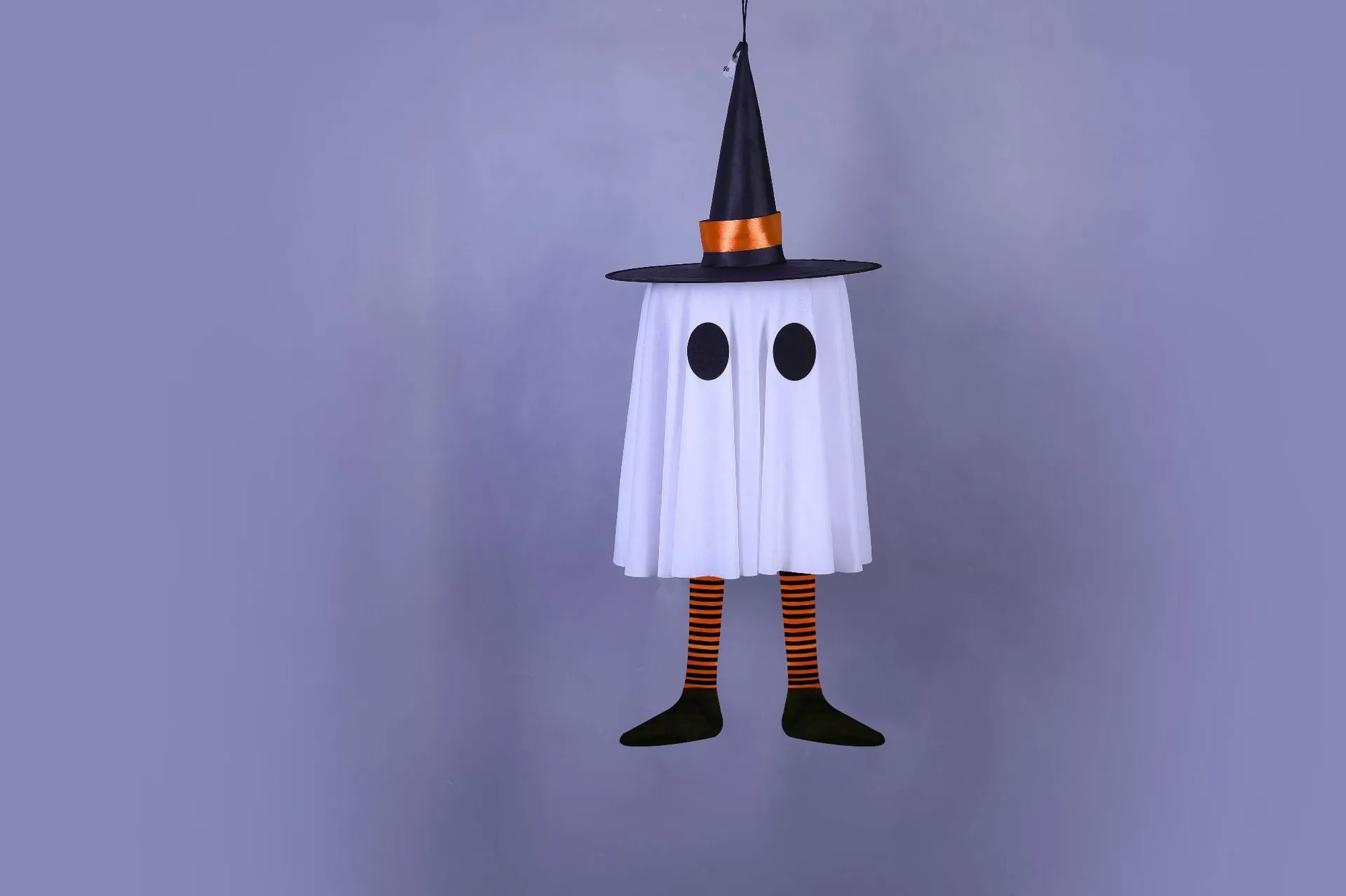 White Halloween wizard hat and ghost LED light string pendant hung indoors