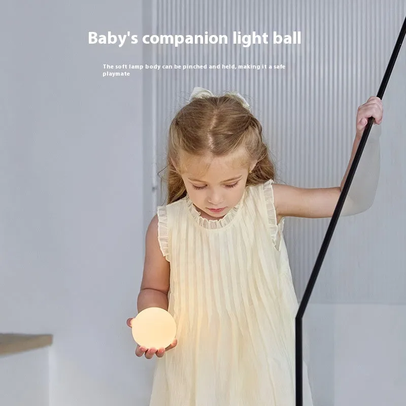 Shell pearl coloured silicone pat induction night light with power storage, disk shape 140x145x160 mm