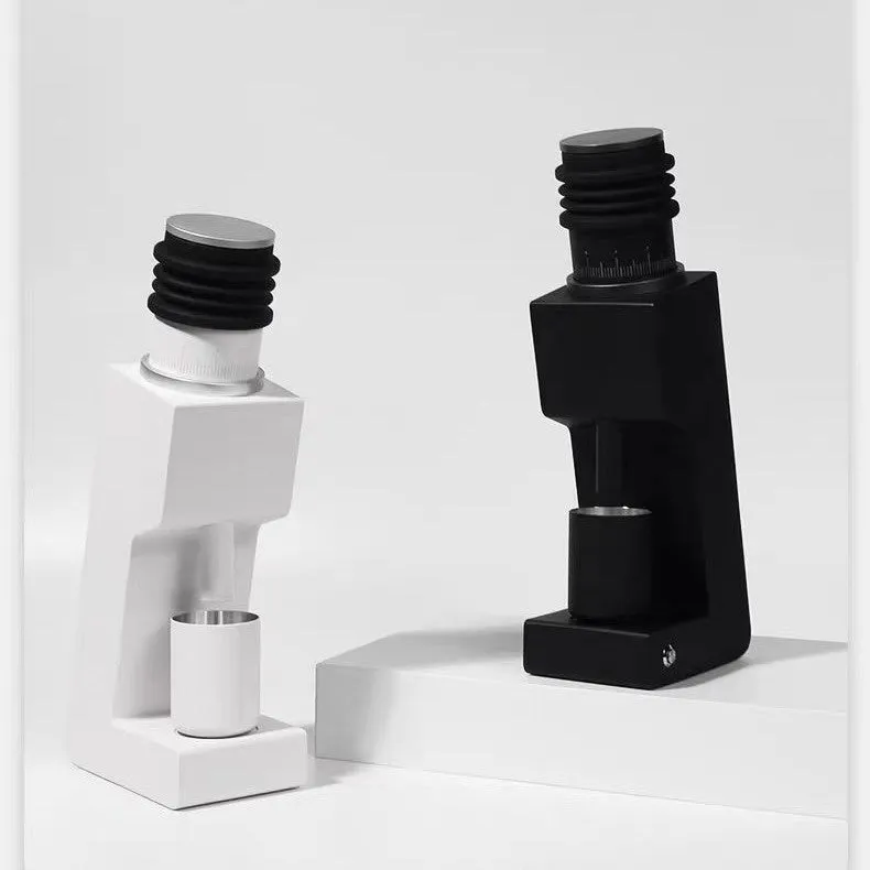 Electric coffee grinder with inclined aluminium alloy body in white on a countertop for home or office use