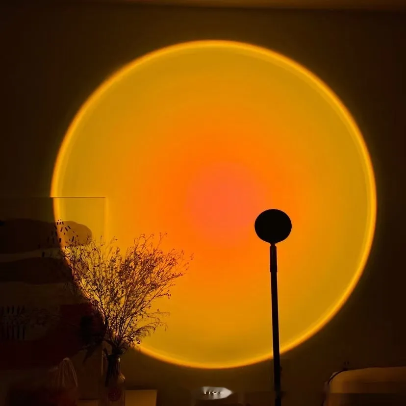 Sunset red USB floor lamp in modern simplicity style, 12.5 x 27 cm, with RGB colour options on a desk.