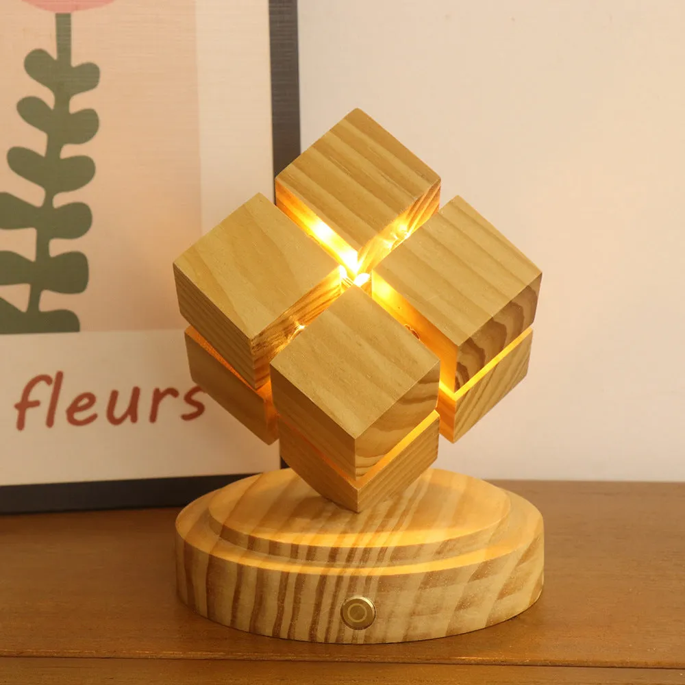 Creative fourth-order Rubik's cube night lamp with rubber wood shade on a wooden surface