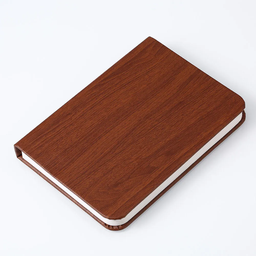 Leather folding night lamp in tricolour lighting on a wooden surface, size small book 10x8x2.5cm