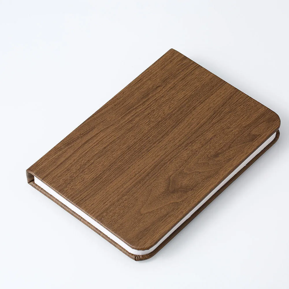 Leather folding night lamp in tricolour lighting on a wooden surface, size small book 10x8x2.5cm