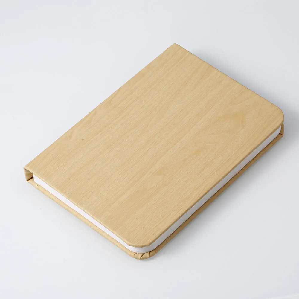 Leather folding night lamp in tricolour lighting on a wooden surface, size small book 10x8x2.5cm