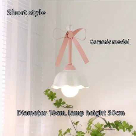 Bow-shaped small pendant lamp in cream style with crown finish, suitable for dining room or bedroom ceiling installation