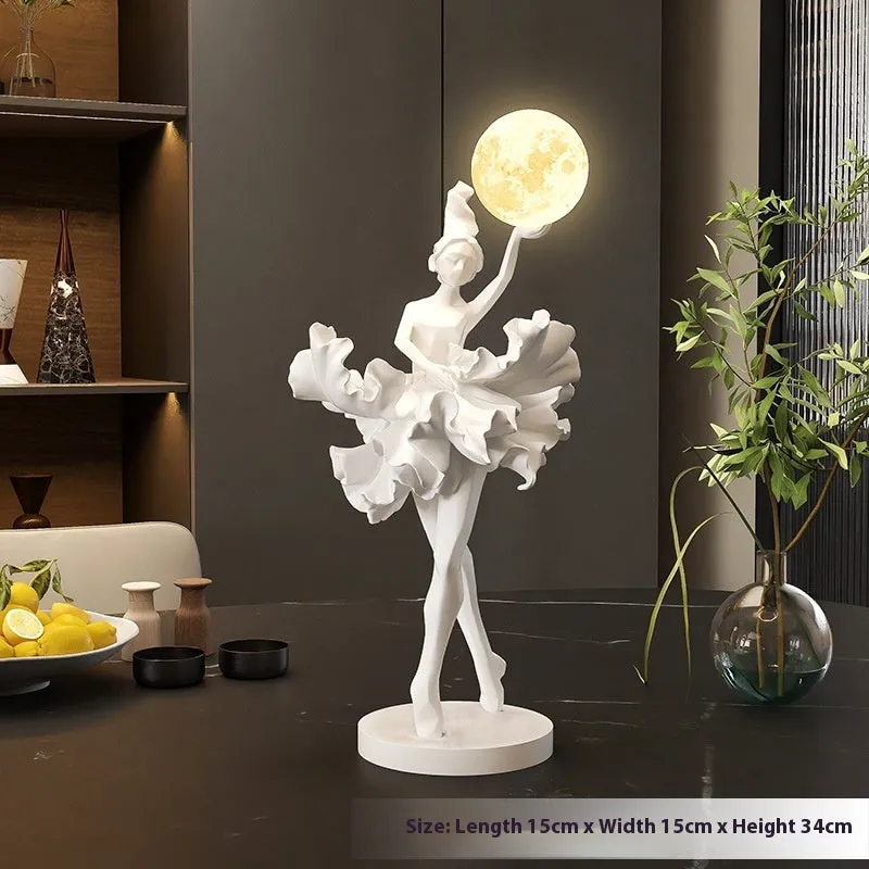 Ballet dancer resin night lamp in pink placed on a hallway table
