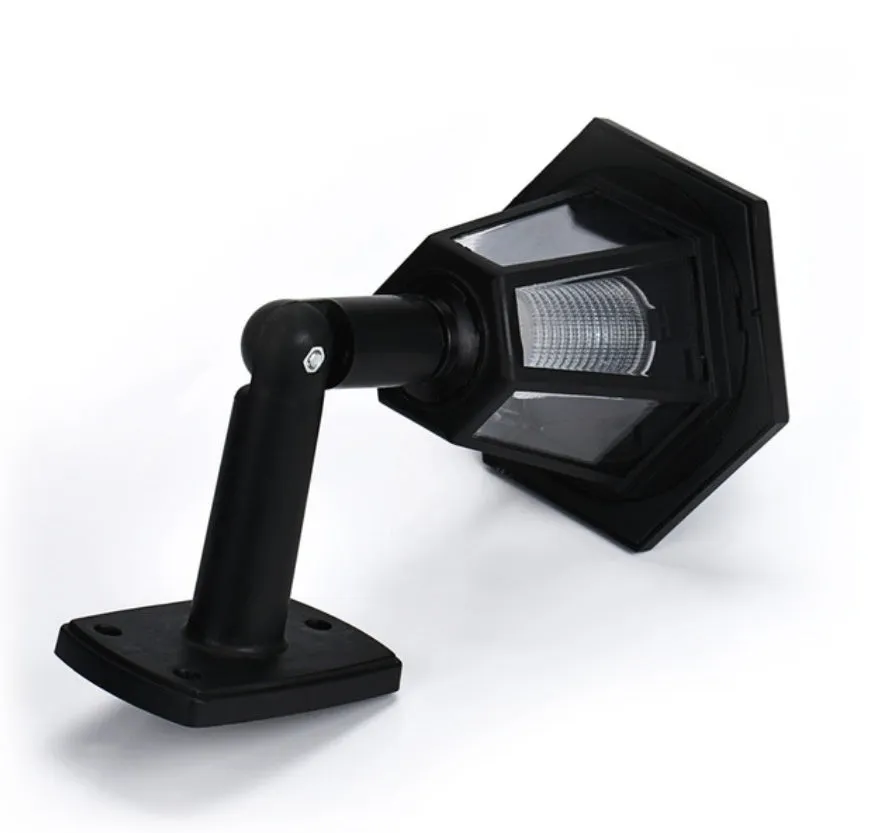 Black hexagonal solar-powered wall light with LED and solar panel for outdoor use