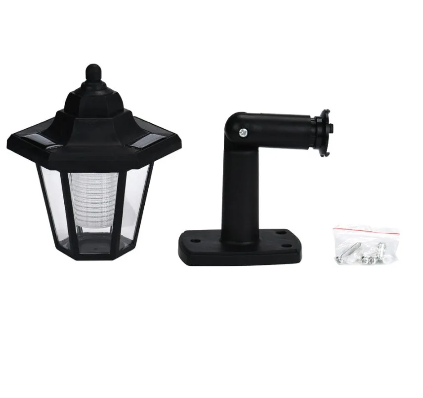 Black hexagonal solar-powered wall light with LED and solar panel for outdoor use