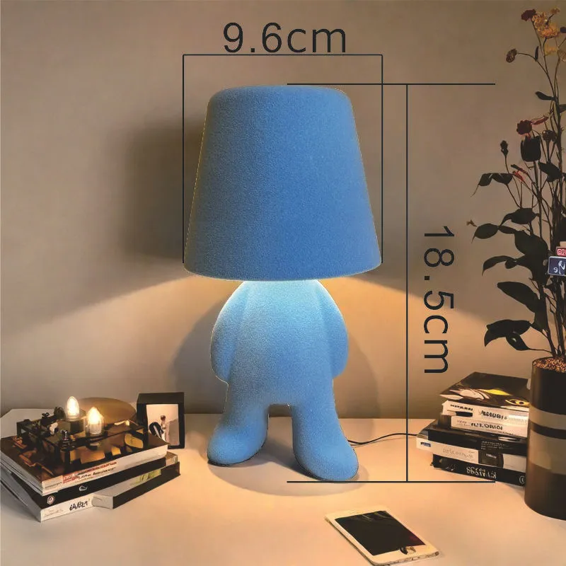 Thinker small gold statue LED night lamp with USB cable on restaurant bar table