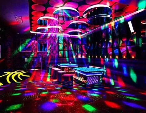 Black or white LED laser magic fan stage light with laser projection and remote control.