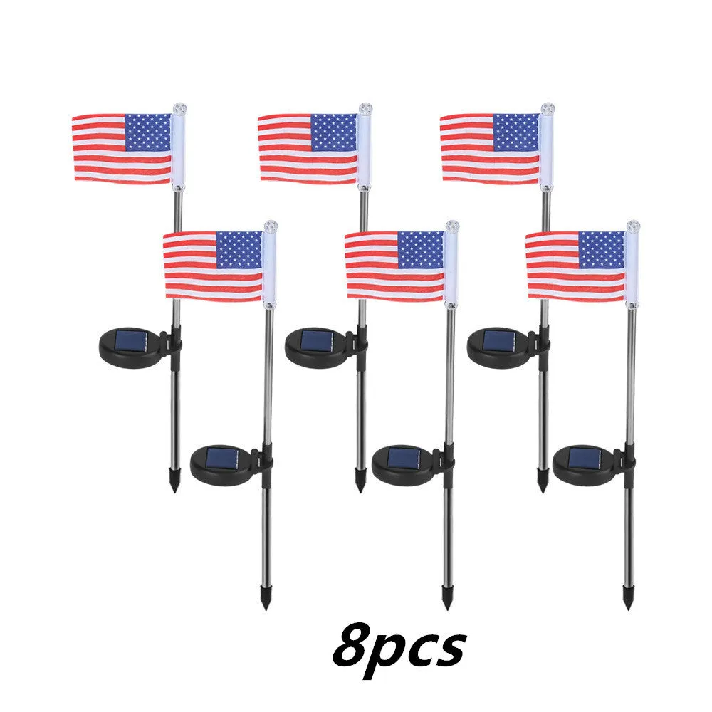 Solar-powered stainless steel garden flag light showing American flag design with white LEDs illuminated.