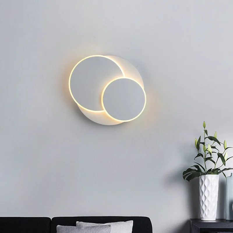 Modern round acrylic wall lamp in black or white, shown in large, medium, and small sizes.