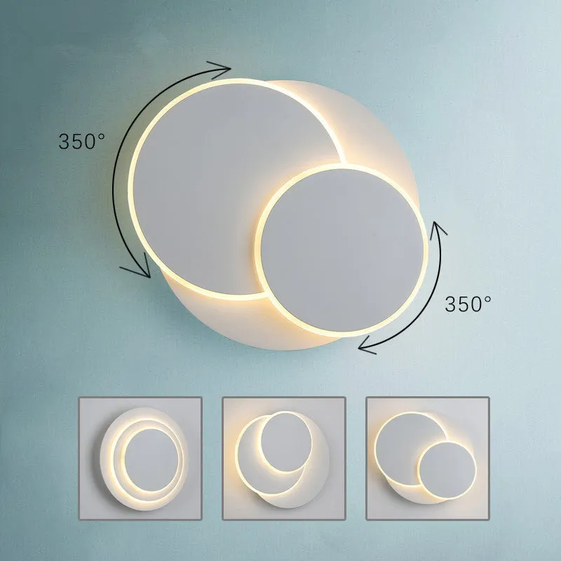 Modern round acrylic wall lamp in black or white, shown in large, medium, and small sizes.