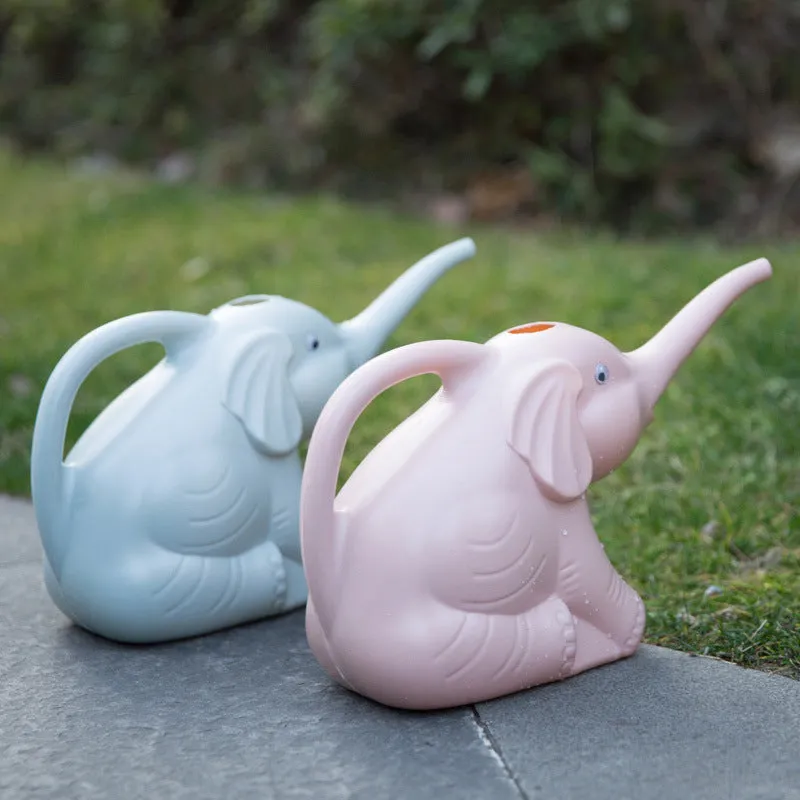 Pink plastic elephant-shaped watering can with a long nozzle and a child-sized handle.