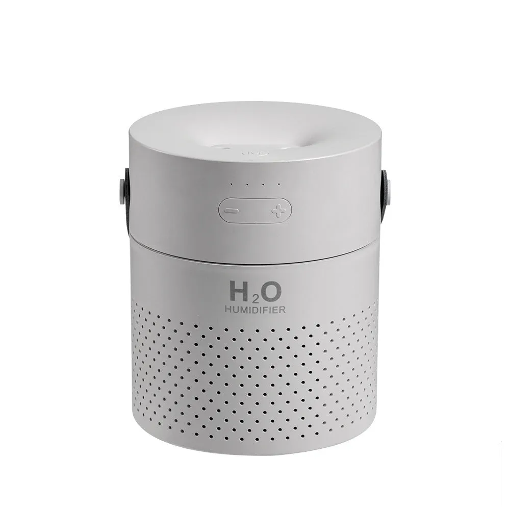 Slim green USB-rechargeable bedroom humidifier with dual mist nozzles and LED light on a wooden surface.