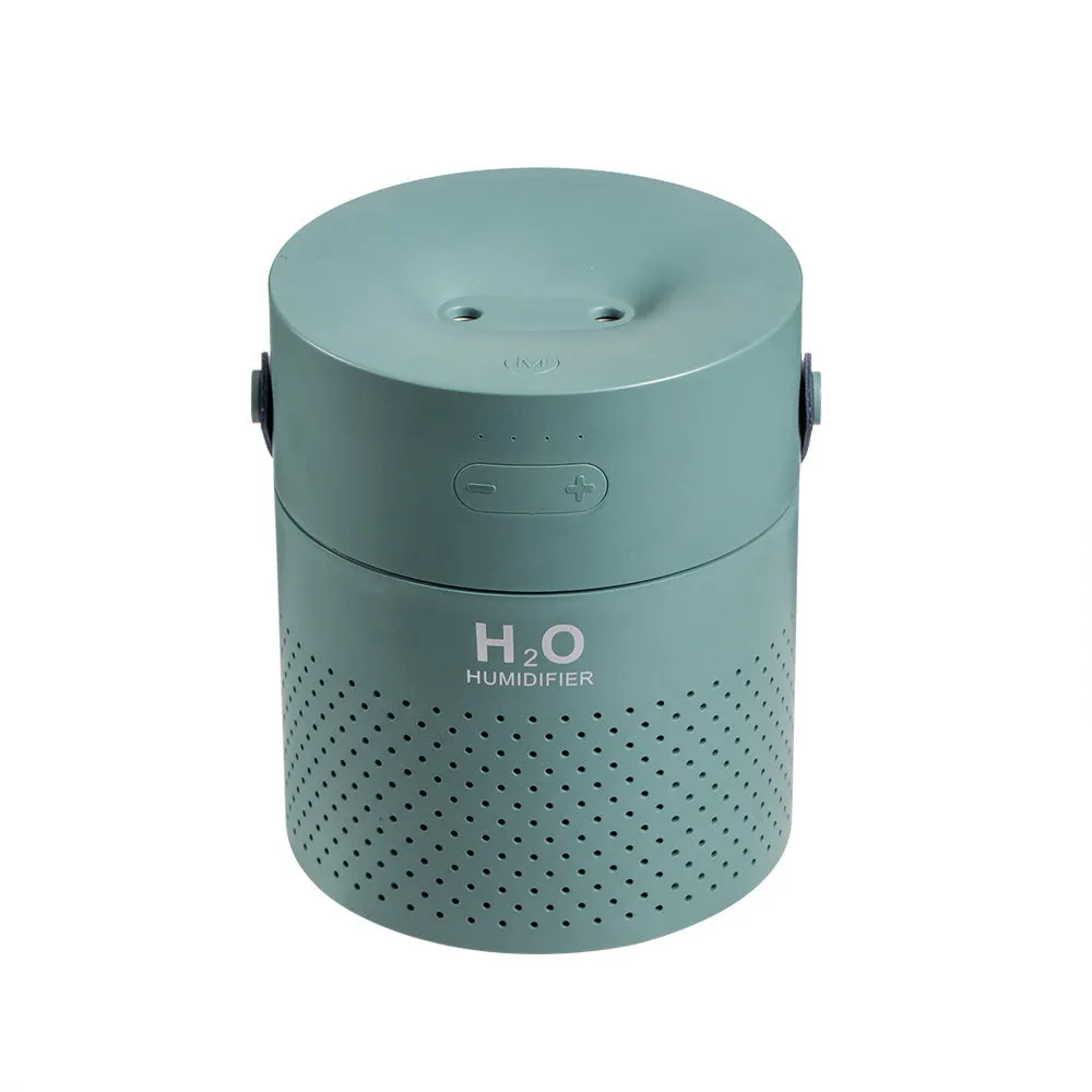 Slim green USB-rechargeable bedroom humidifier with dual mist nozzles and LED light on a wooden surface.