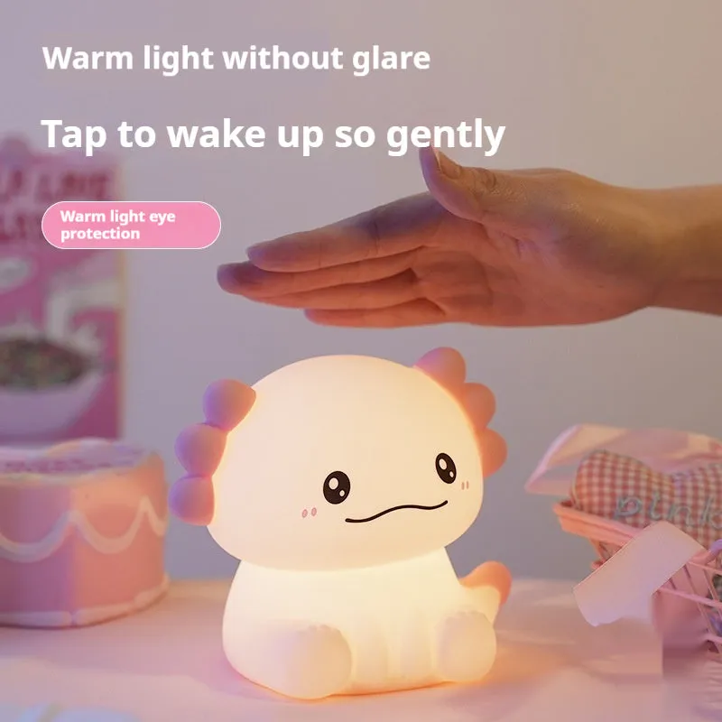 Hexagonal dinosaur silicone night lamp with built-in battery on a bedside table