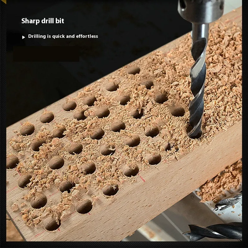 Set of five steel woodworking twist drill bits with hexagonal handles placed on a surface