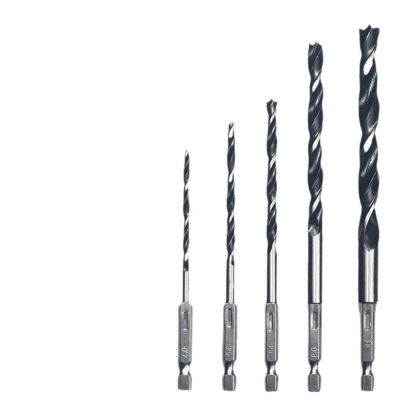 Set of five steel woodworking twist drill bits with hexagonal handles placed on a surface