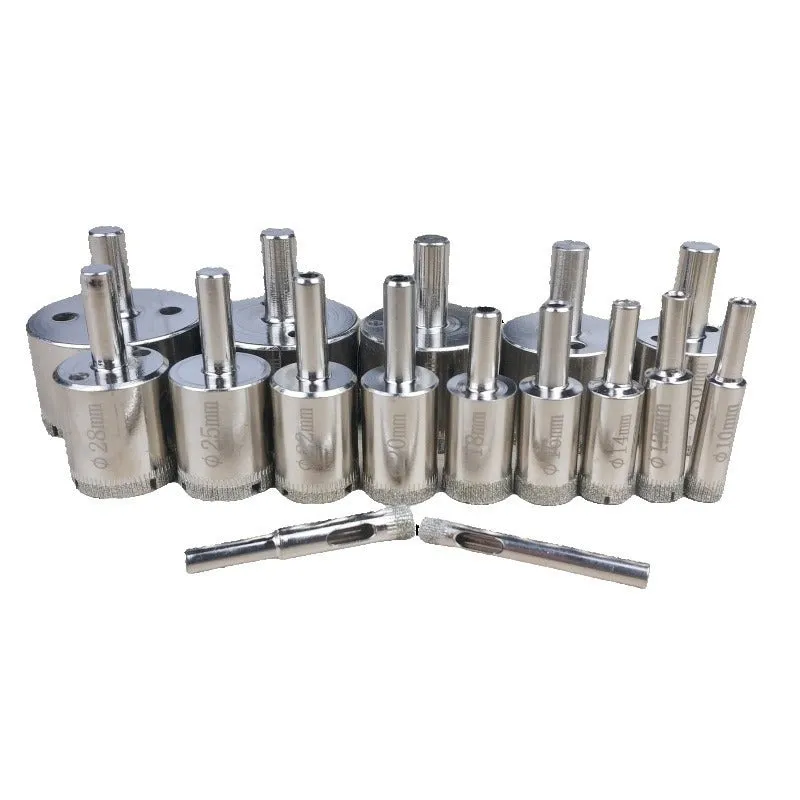 Electroplated tile rock plate drill bit set with one-piece steel construction on a work surface