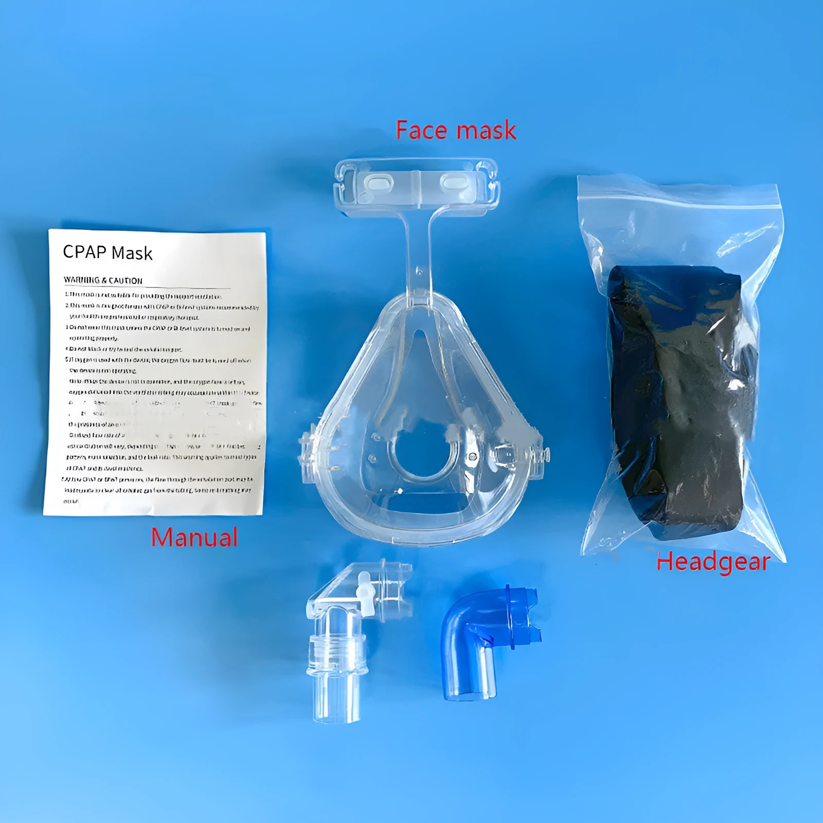 Transparent silicone CPAP breathing mask with headband and PC elbow adapters on a white background.