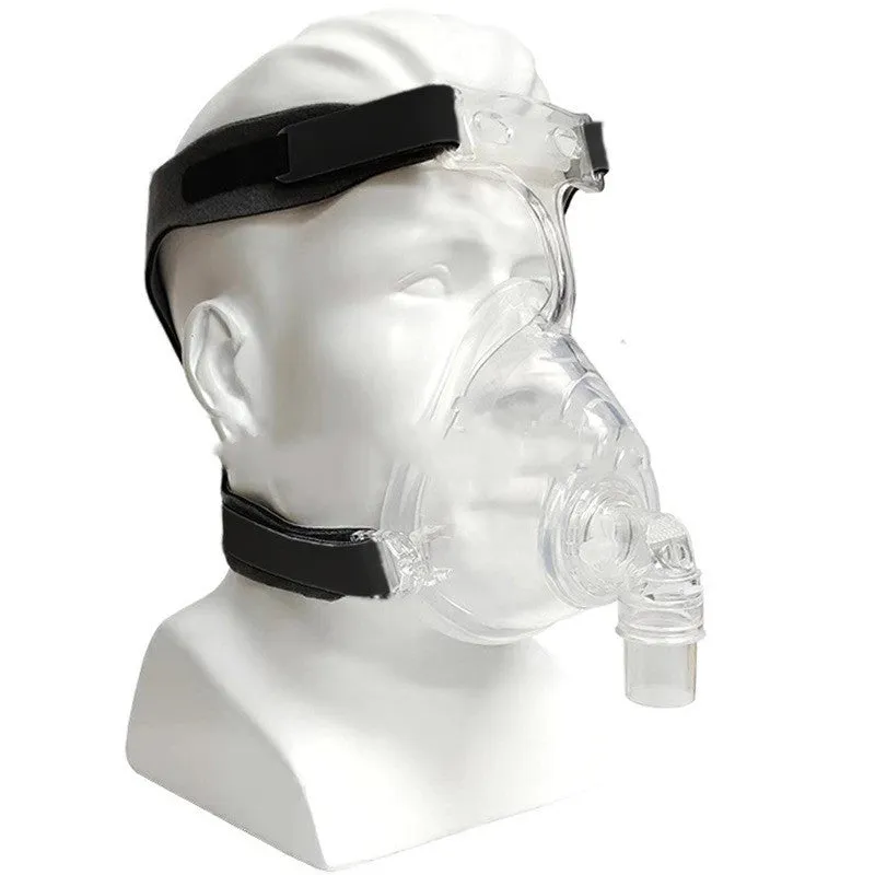 Transparent silicone CPAP breathing mask with headband and PC elbow adapters on a white background.