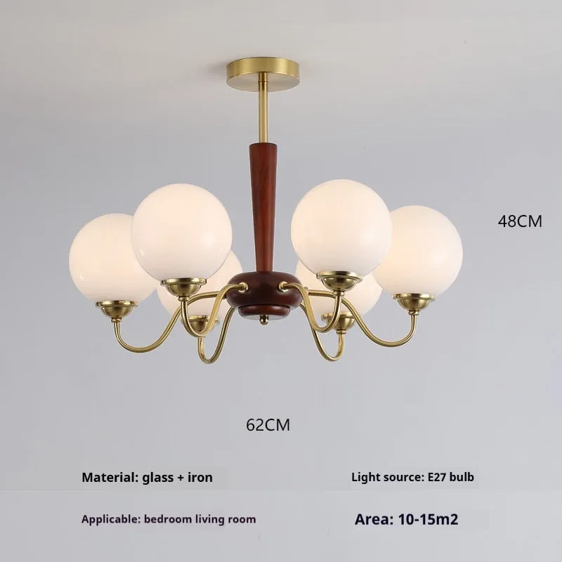 American retro persimmon chandelier with amber yellow glass shades in a dining room setting