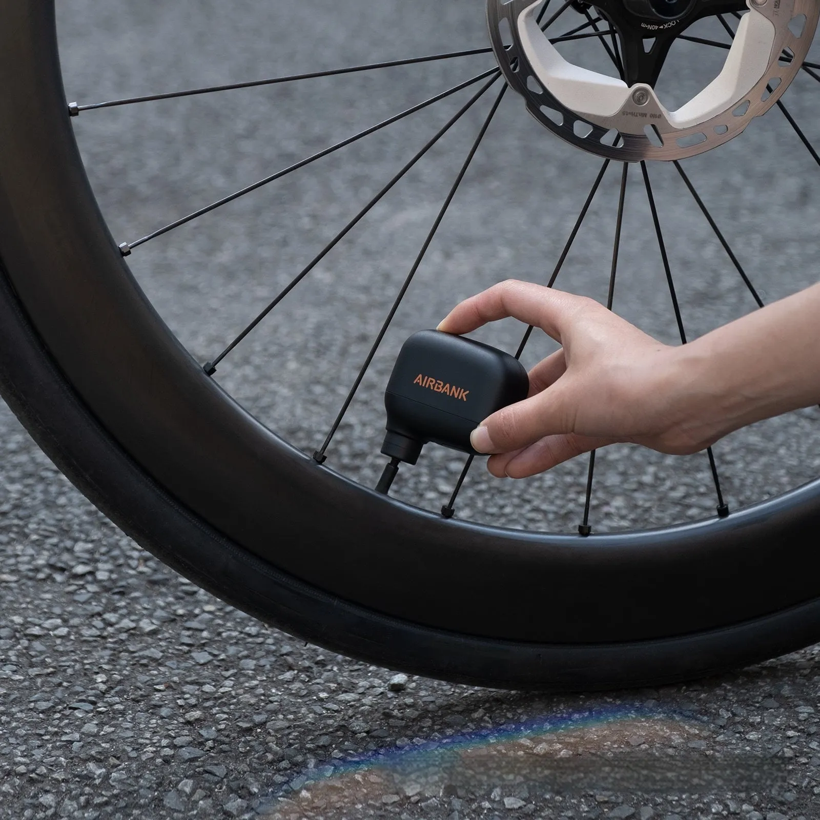 Black AS100 mini electric bicycle tyre pump with USB cable and waterproof carry bag