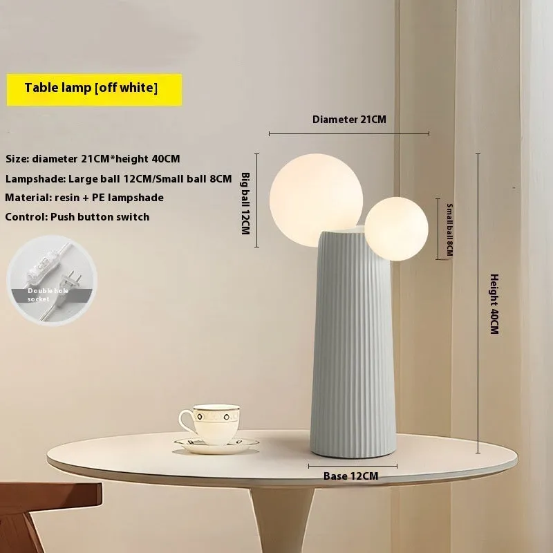 Modern minimalist cactus bedside lamp in milk coffee colour, resin and PE lampshade, 21cm diameter 40cm height, on bedside table