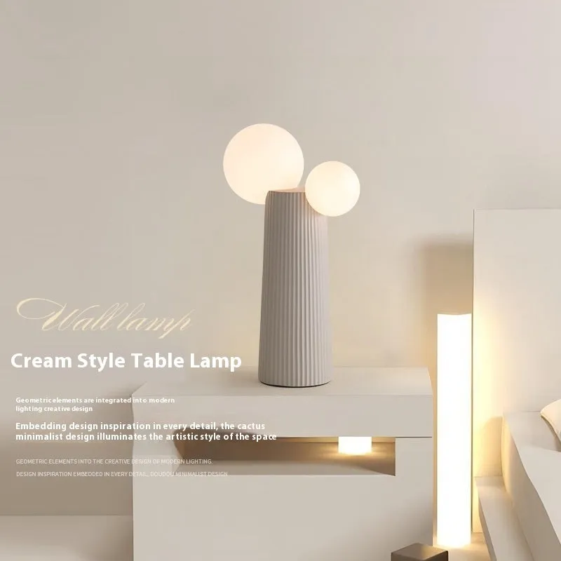 Modern minimalist cactus bedside lamp in milk coffee colour, resin and PE lampshade, 21cm diameter 40cm height, on bedside table