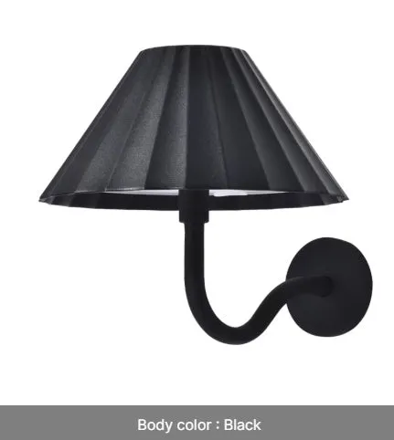 Alloy desk lamp with black finish, warm LED light, and touch dimming switch on a desk