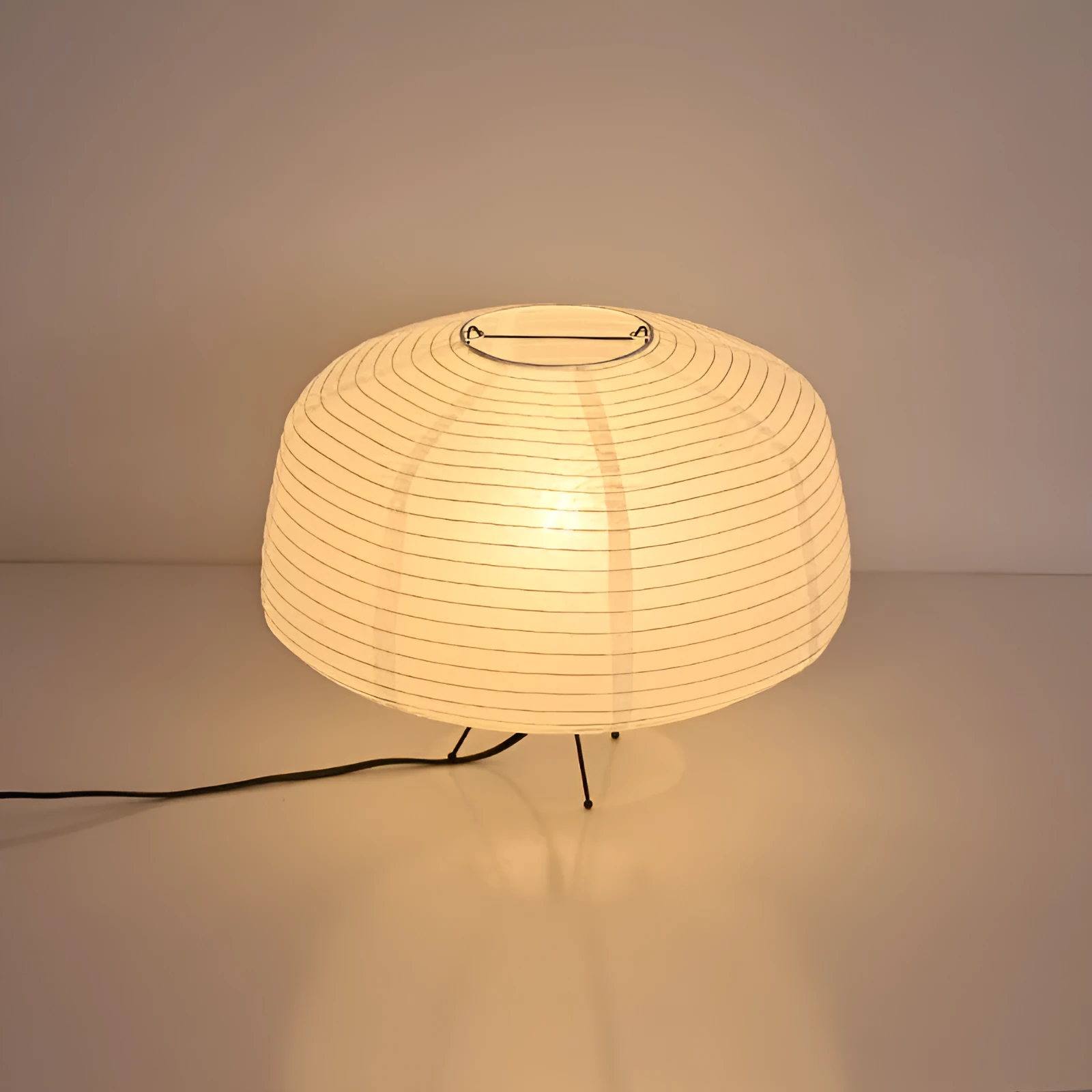 Japanese style xuan paper desk lamp with three-colour light source on a wooden desk in a bedroom