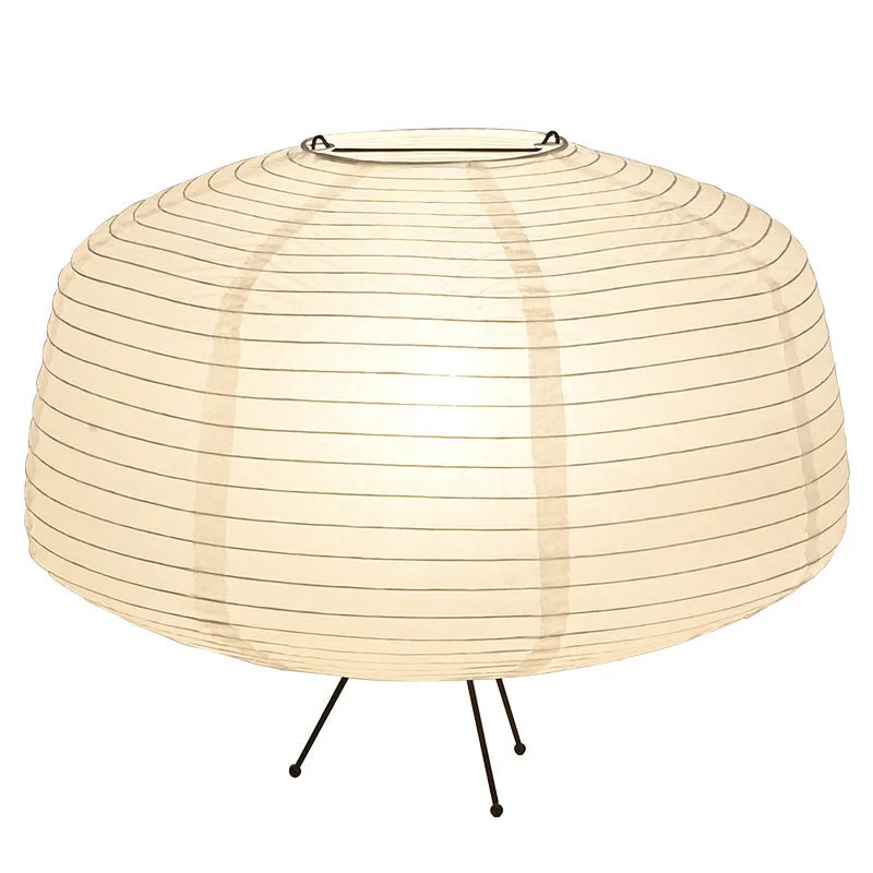 Japanese style xuan paper desk lamp with three-colour light source on a wooden desk in a bedroom