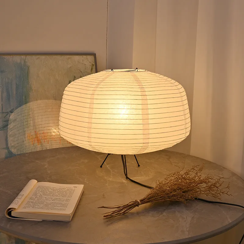 Japanese style xuan paper desk lamp with three-colour light source on a wooden desk in a bedroom
