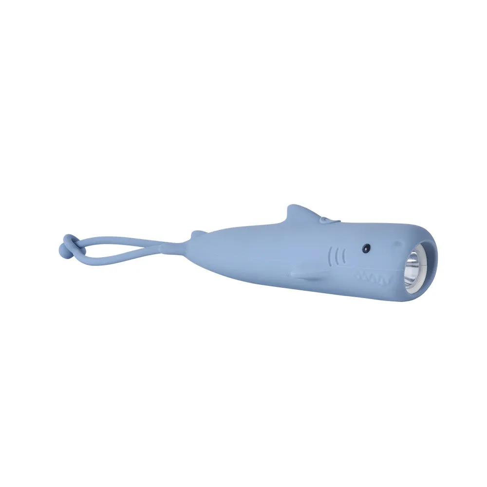 Four silicone animal toy flashlights in Blue Shark, Brown Lion, Brown Puppy, and Green Crocodile designs