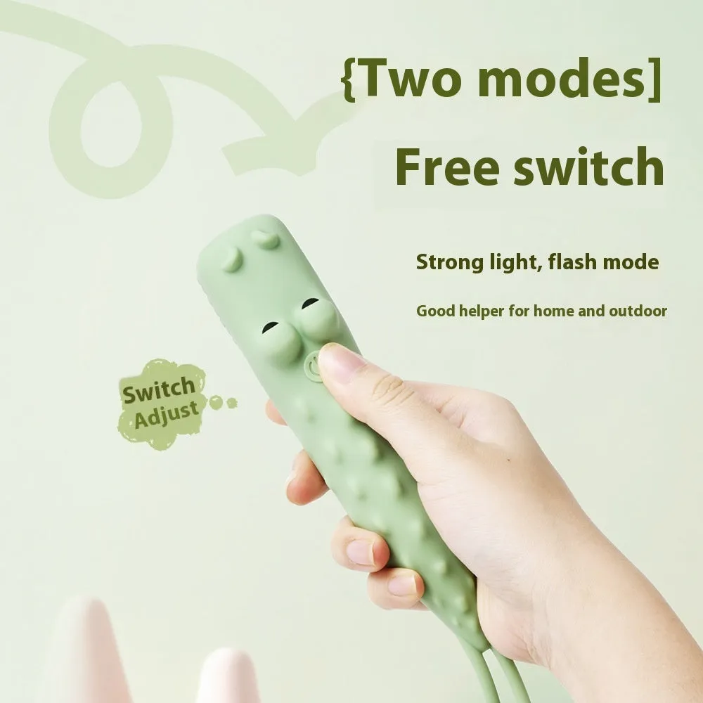 Four silicone animal toy flashlights in Blue Shark, Brown Lion, Brown Puppy, and Green Crocodile designs