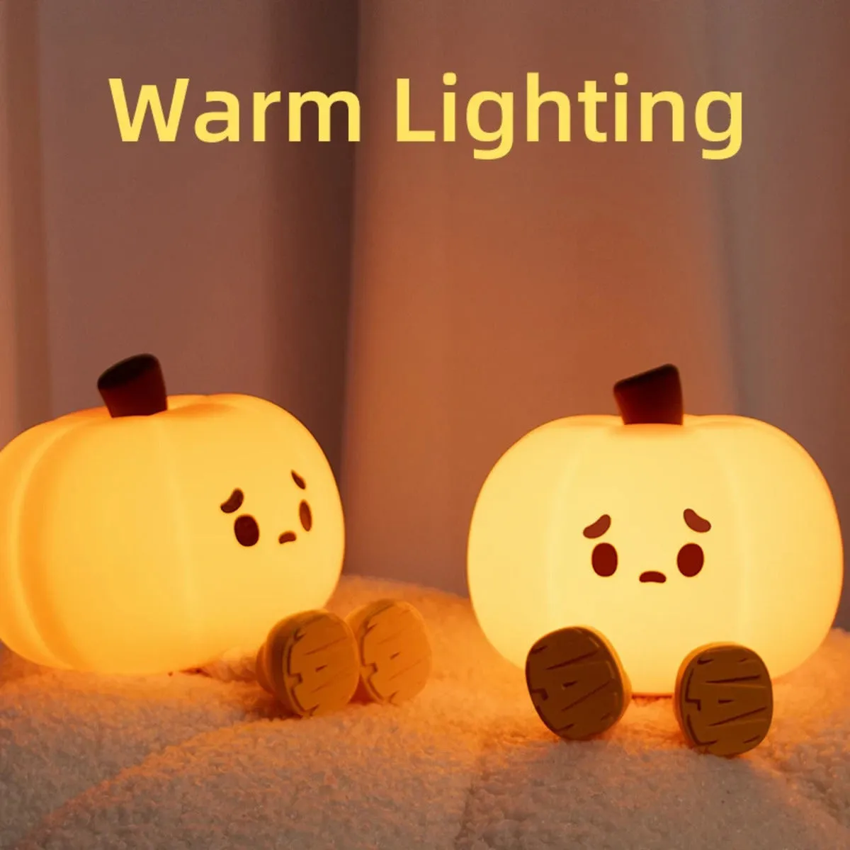 Pumpkin-shaped silicone night light with rechargeable battery on a bedside table