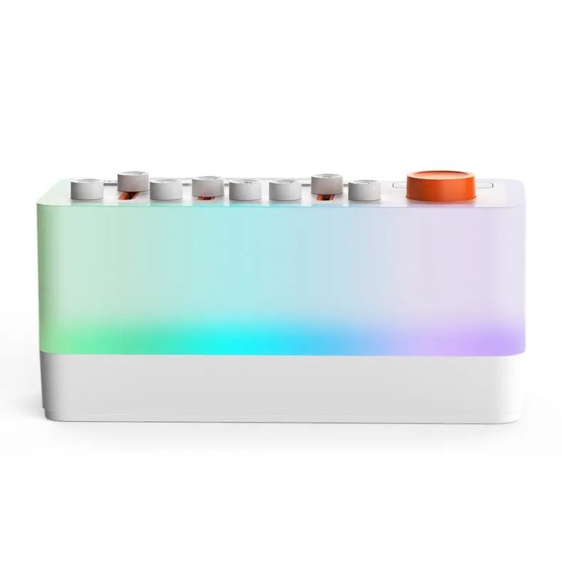 White DIY smart sleep speaker RGB colour small night lamp with alarm and call functions on a bedside table