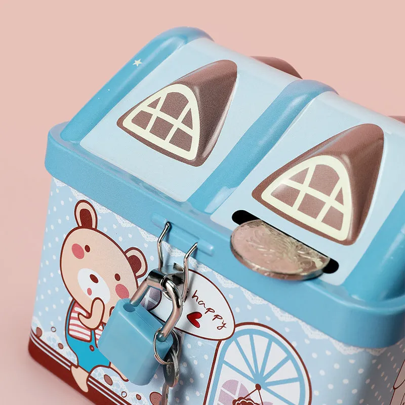 Blue house-shaped tinplate piggy bank for coins on a wooden desk