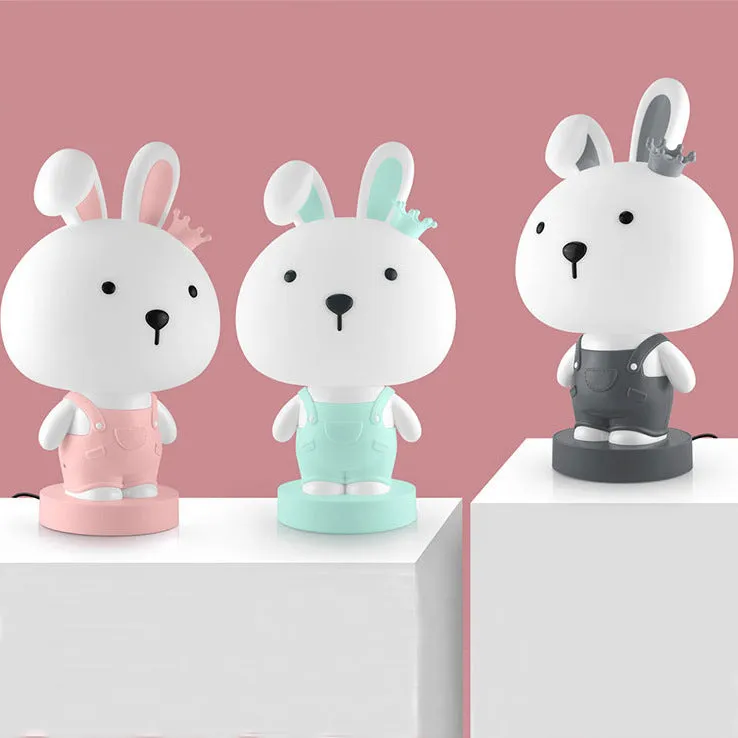 Cartoon animal table lamp in plastic, available as a bear, cow, rabbit, or tiger design.