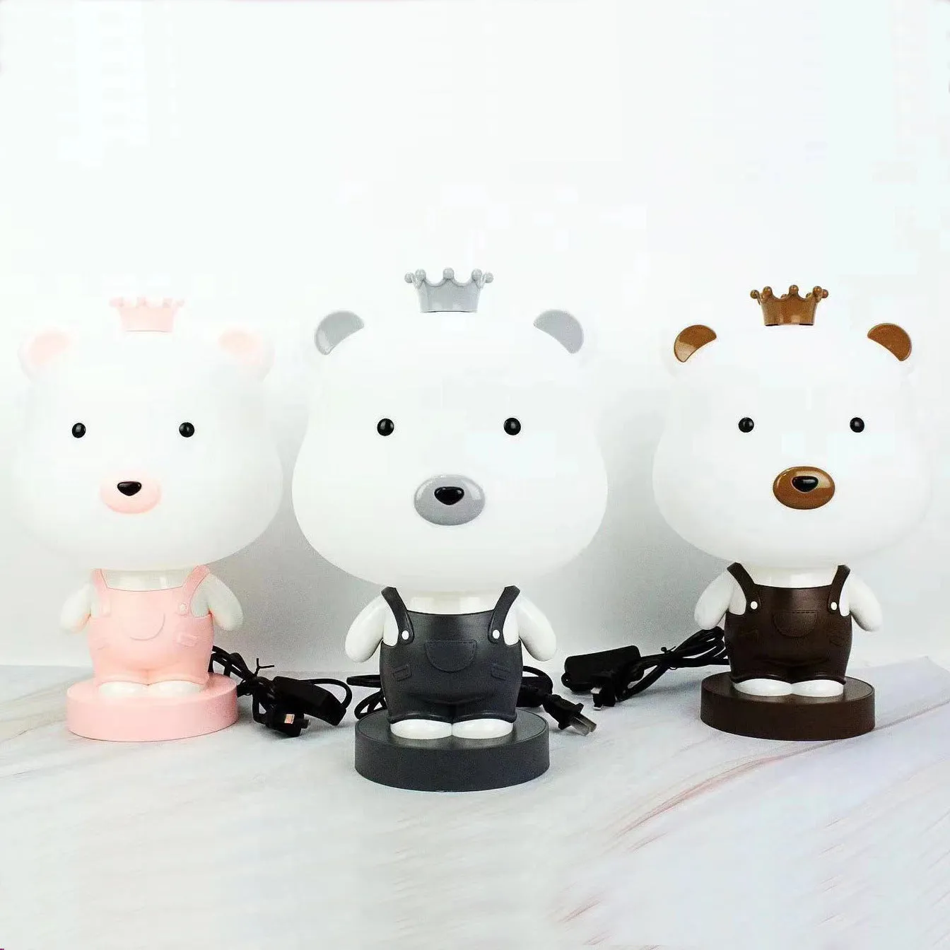 Cartoon animal table lamp in plastic, available as a bear, cow, rabbit, or tiger design.